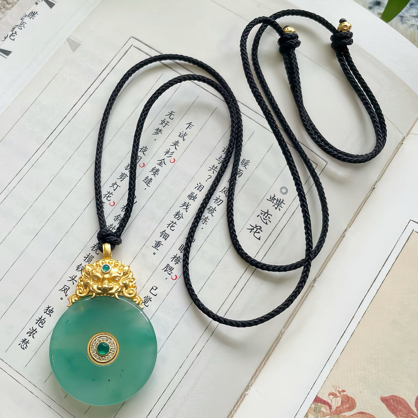 Handcrafted Natural Green Jade Round Pendant with Gilded Brass Lion Head · Adjustable Black Rope Chain · Original Design